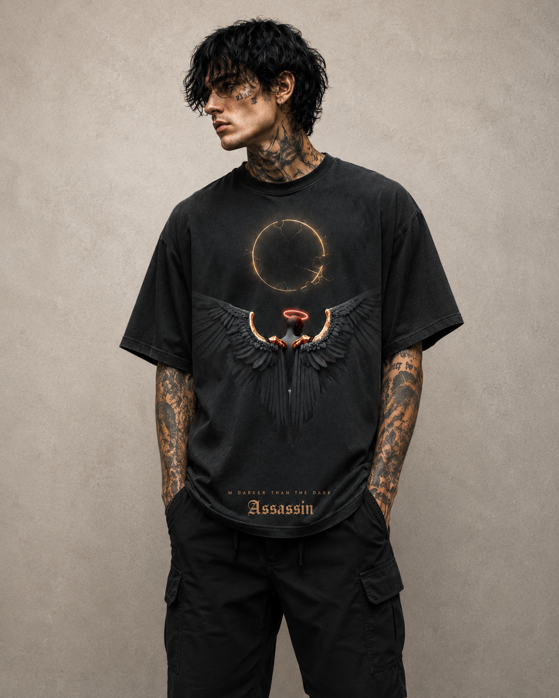 Man wearing a black t-shirt with a graphic design on a beige background