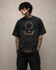 Man wearing a black t-shirt with a graphic design on a beige background